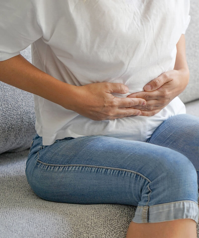 woman holding stomach
